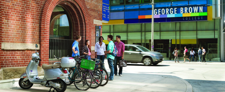 Students stand near bike racks outside St. James Campus Frederick and Adelaide Street corner